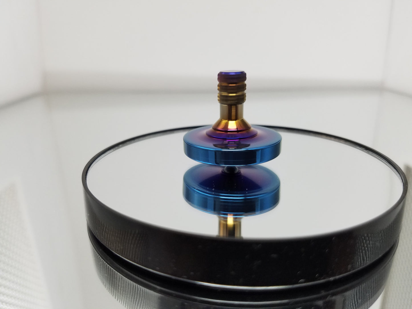 Titanium Spinning Top with a Heat Anodized Finish - Kemner Design